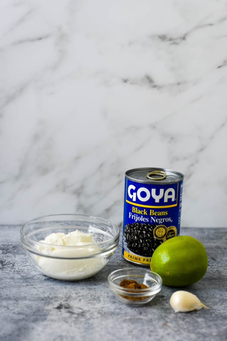 ingredients for easy black bean dip - black beans, greek yogurt, lime, and spices