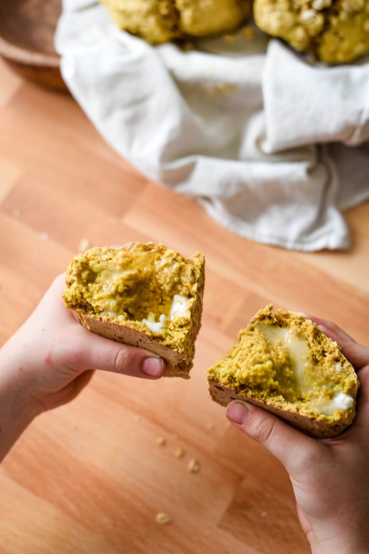 viking bread held in childs hand with melted butter