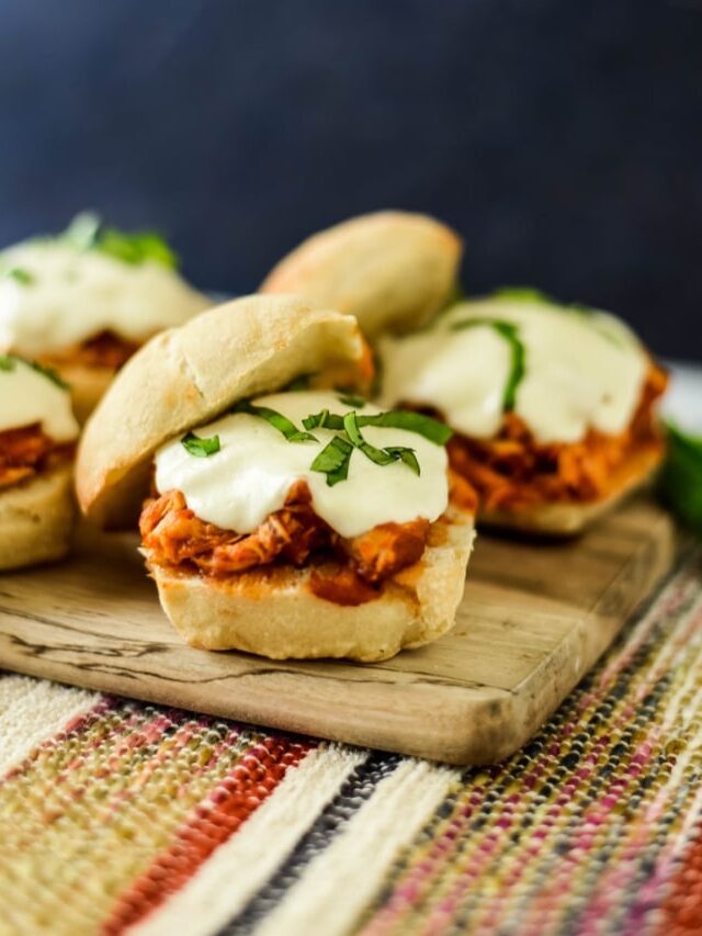 chicken sandwiches on wooden board