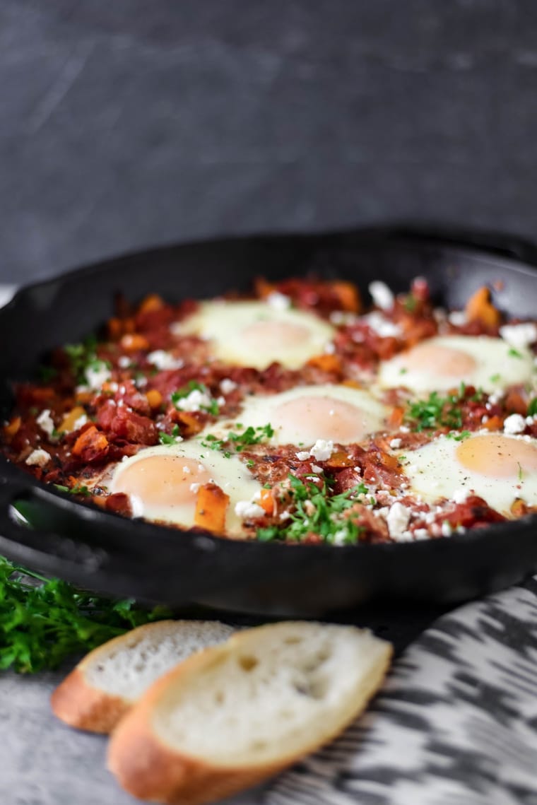 shakshuka in cast iron pan with bread