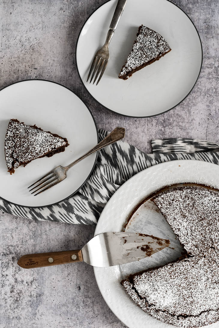 three pieces of Kladdkaka cake on white plates