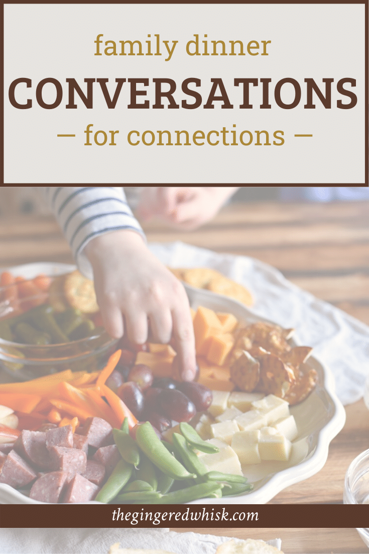 child\'s hand taking food off of a plate, with text overlay reading \"dinner conversations for connections\"