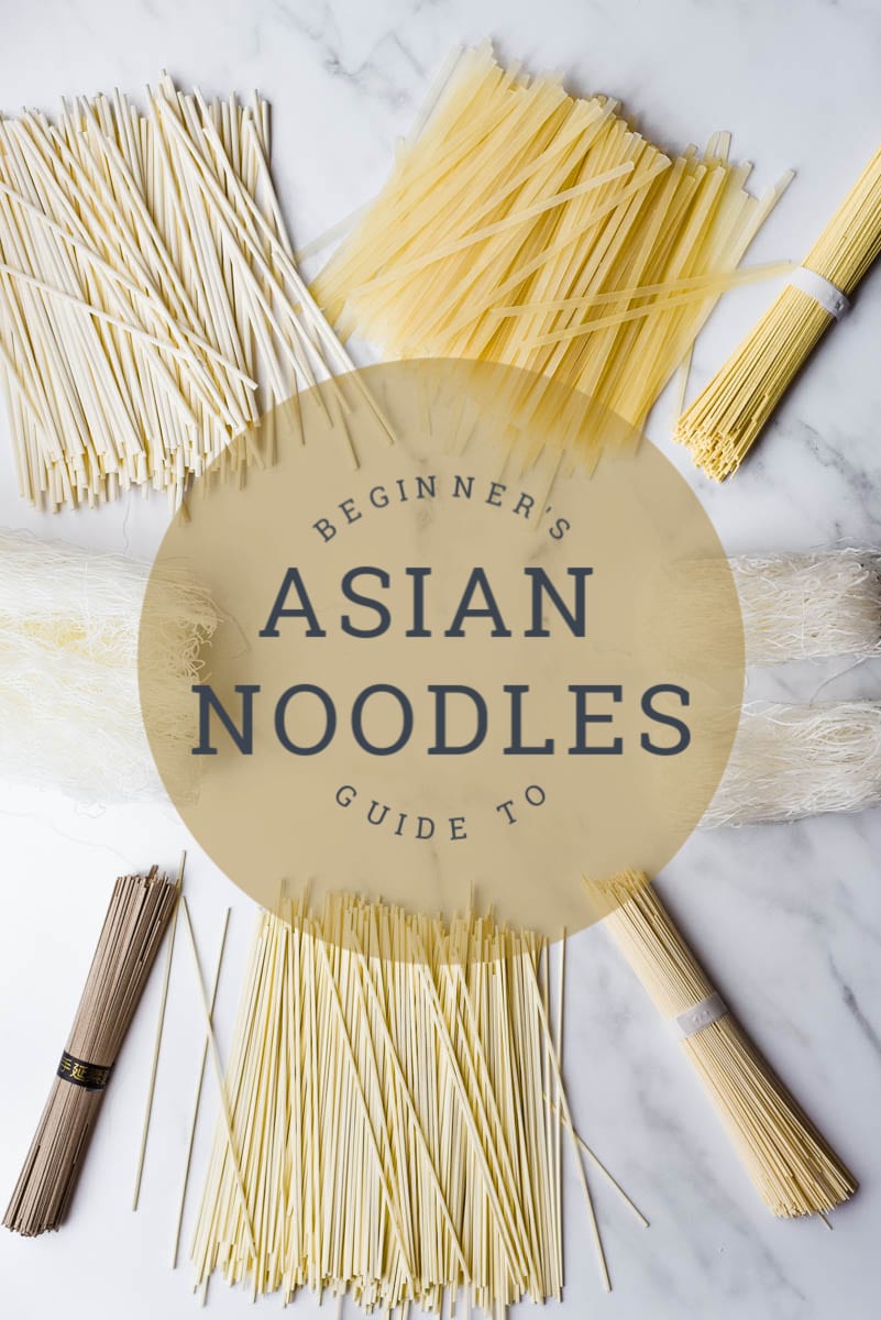 different noodle types on marble board with text overlay that says \"beginners guide to asian noodles\"