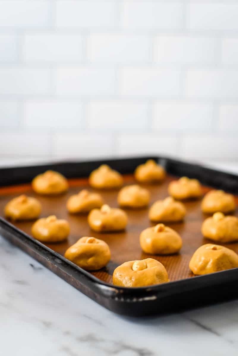 baking tray with chinese peanut cookies on silicone mat