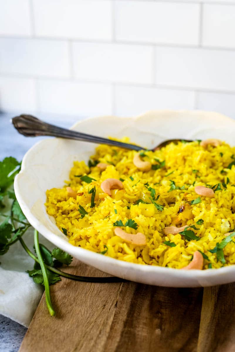 side view of lemon rice in white bowl