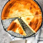 fromage tart on wire cooling rack with one piece off center