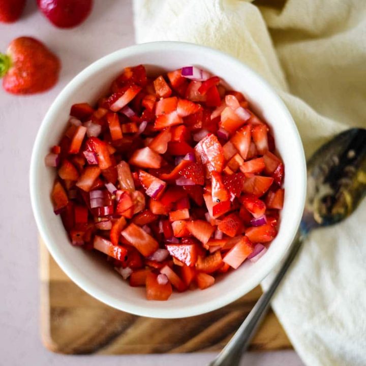 a bowl of salsa made with strawberries