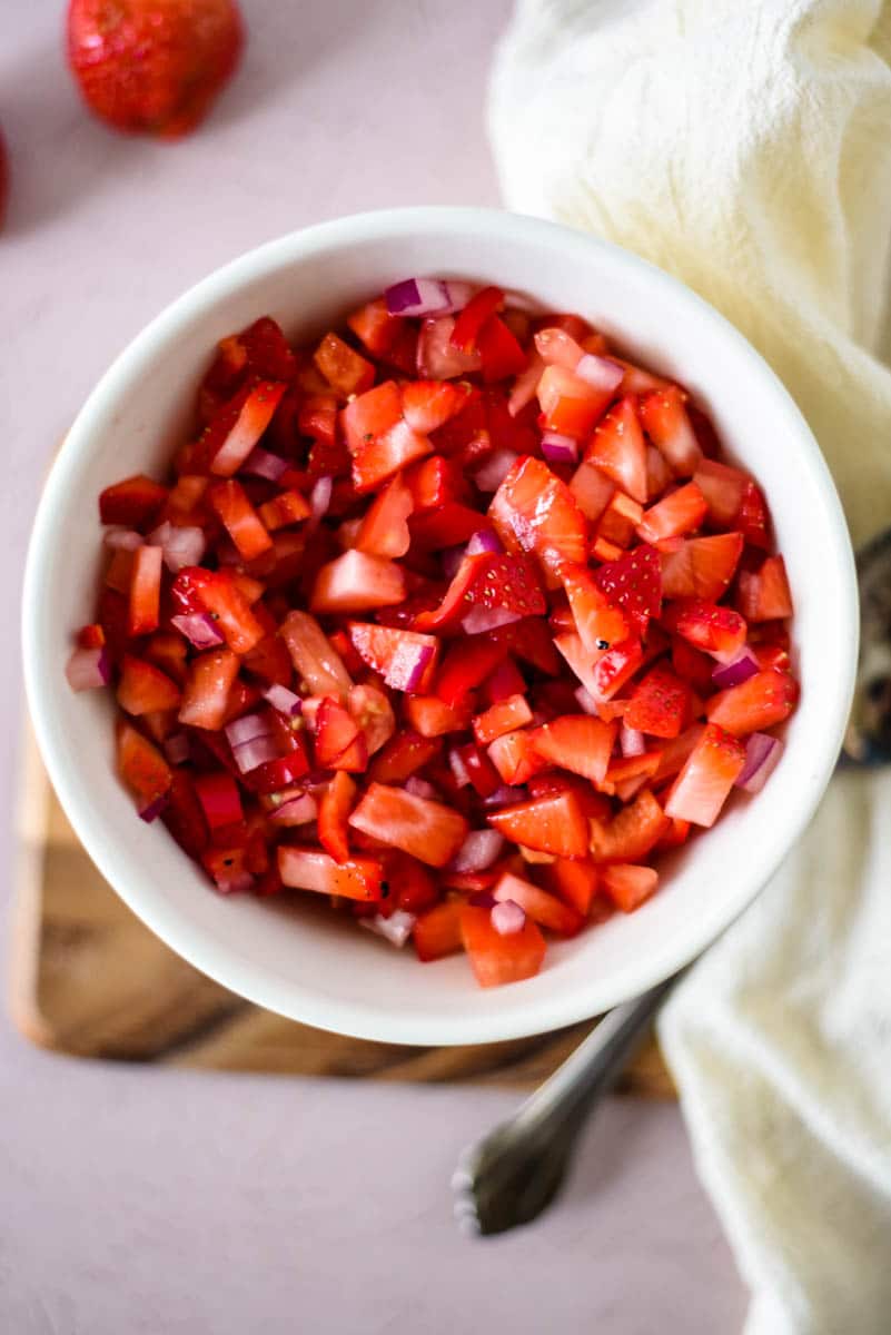overhead of strawberry salsa in white bowl