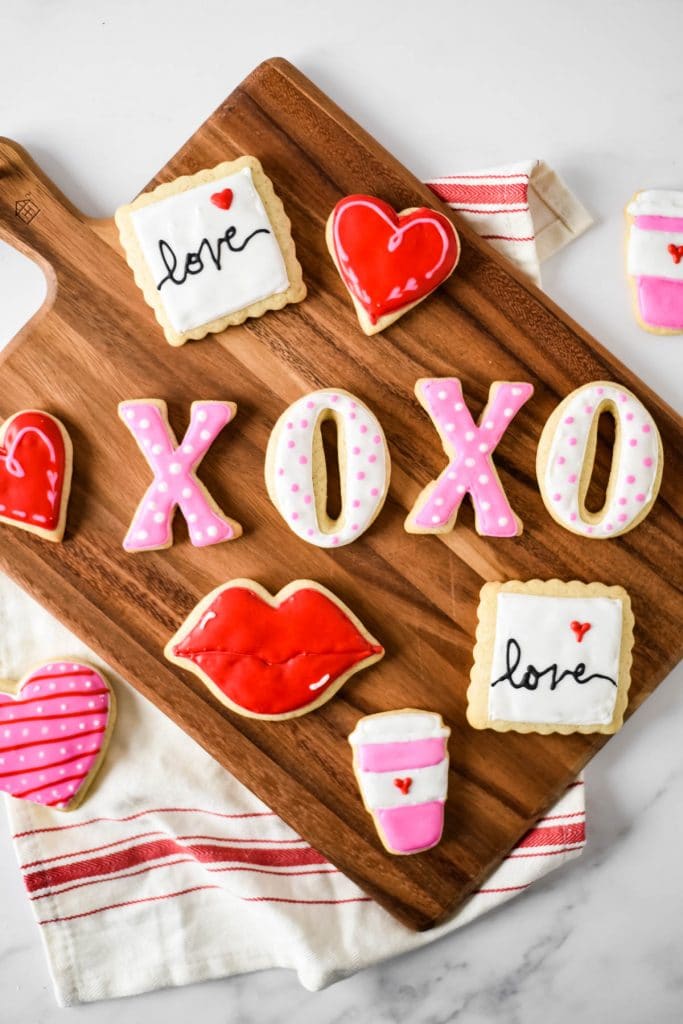 valentines day cut out cookies on wooden board