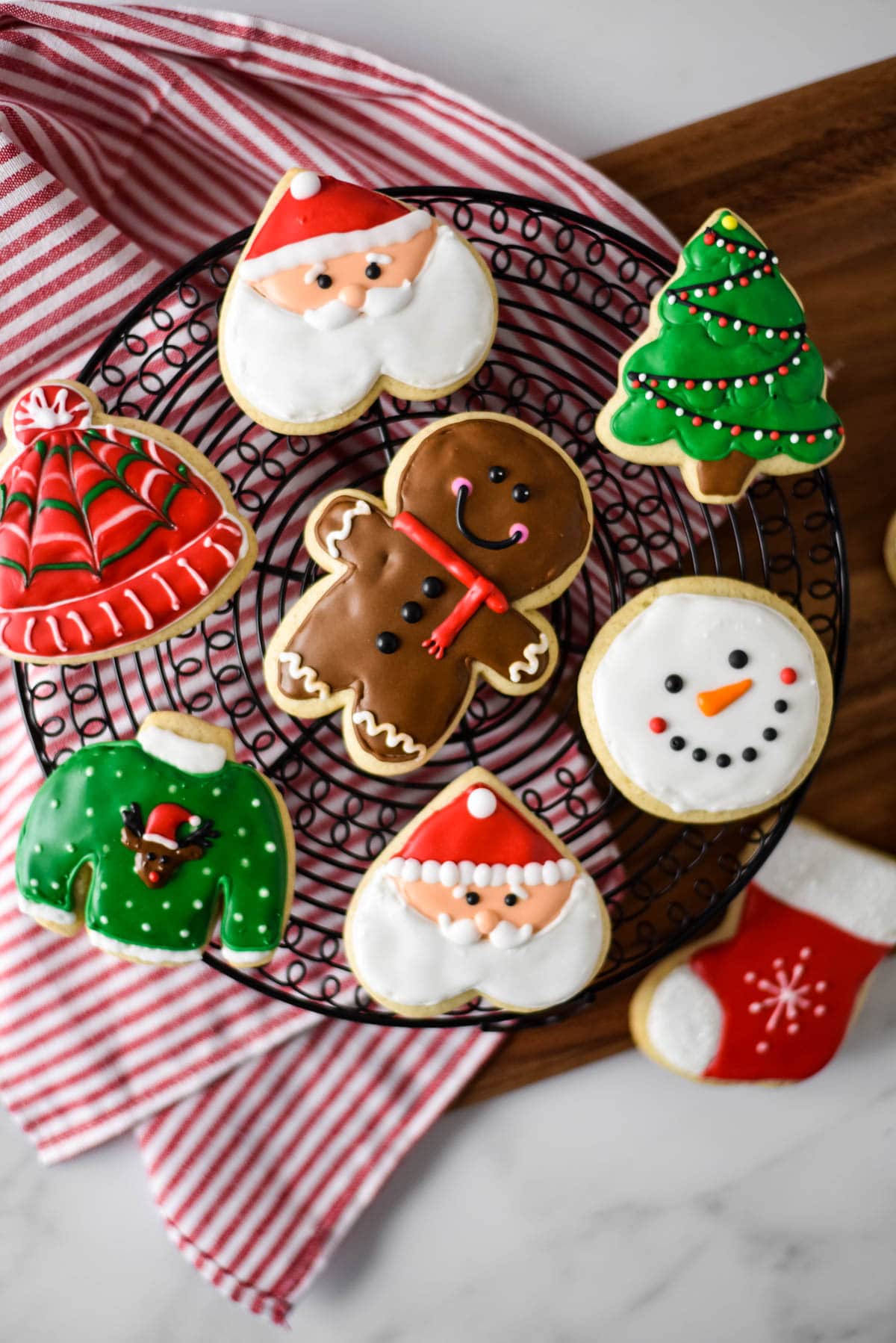 cooking tray filled with christmas decorated cut out cookies