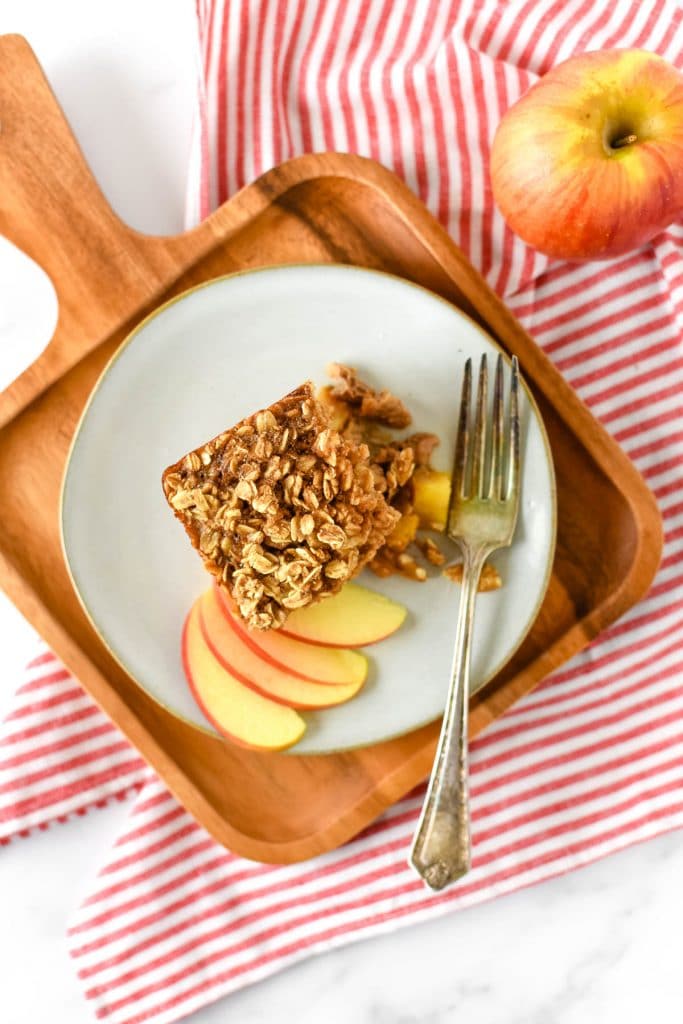 baked apple oatmeal on plate with fork