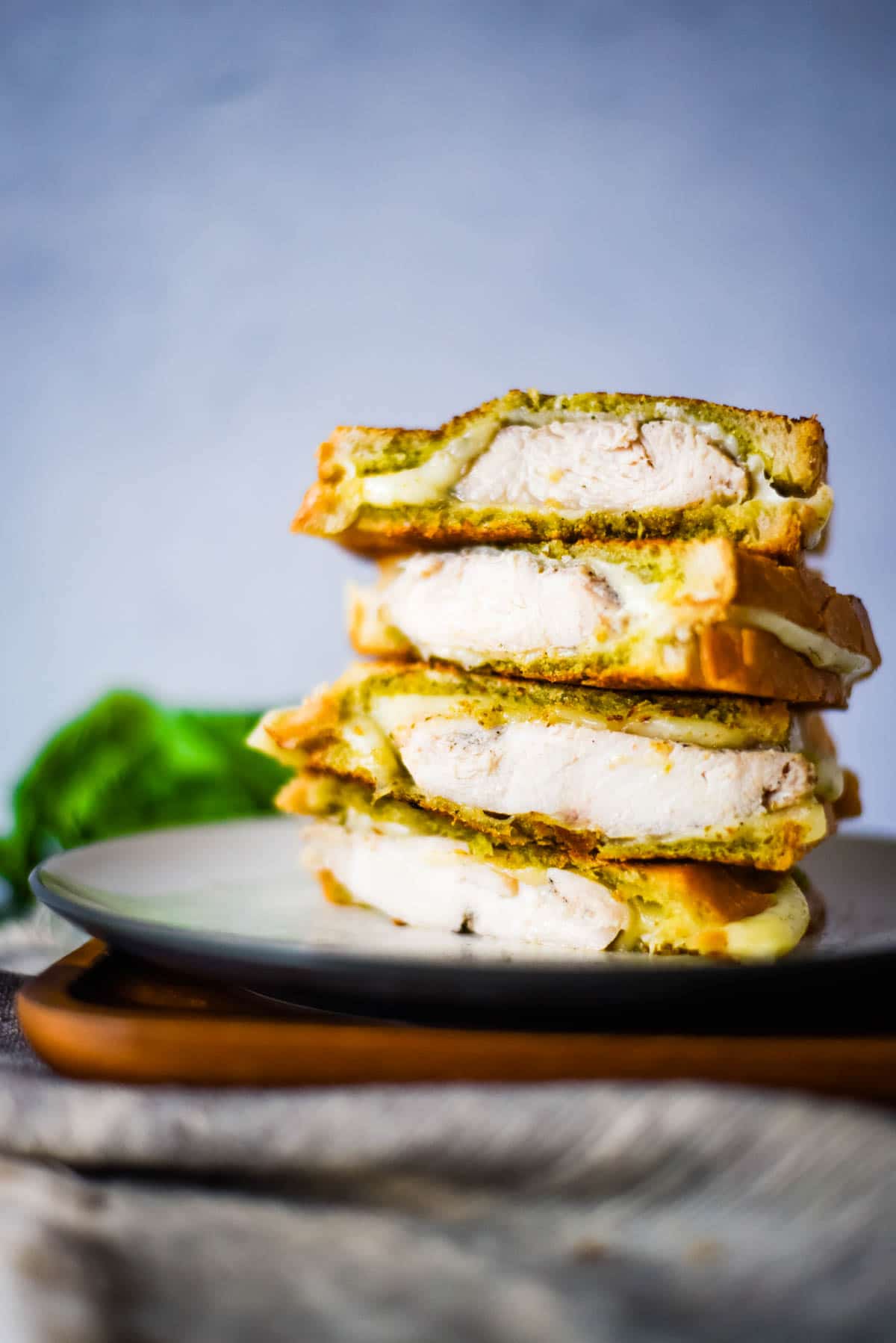 chicken grilled cheese sandwiches stacked on a plate