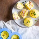 egg bites on plate next to silicone mold of egg bites