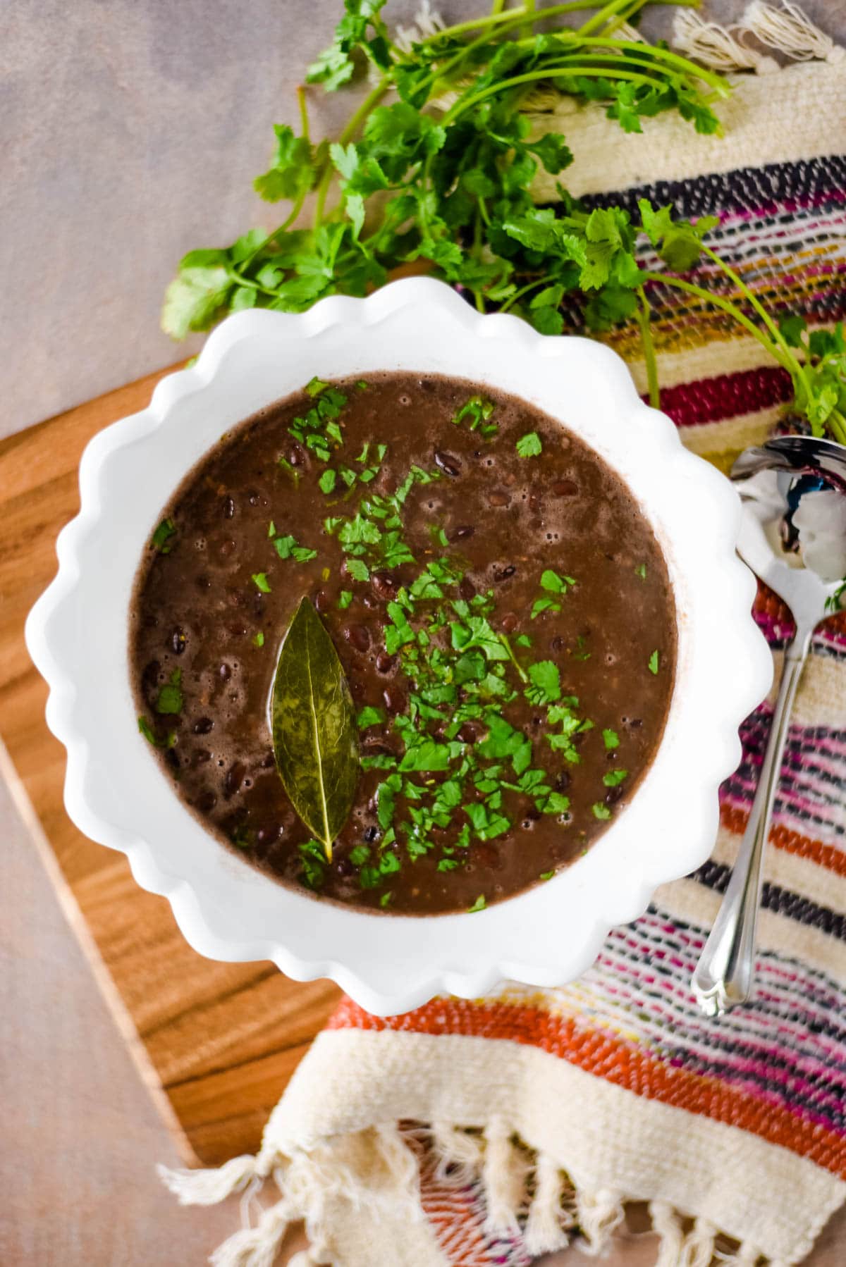 overhead of black beans with cilantro on top