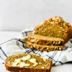 freshly baked wheaten bread with slices and butter