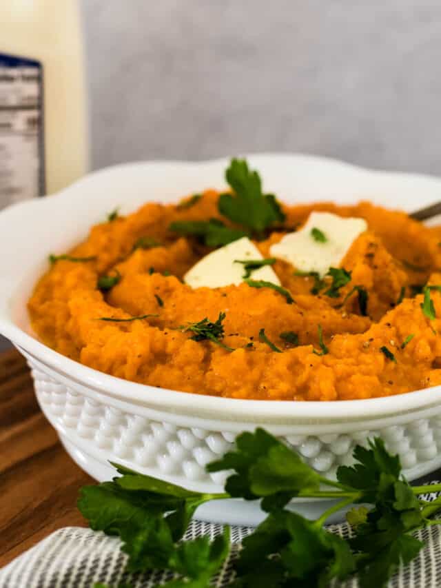 white serving bowl with mashed sweet potatoes and AE dairy bottle of milk behind