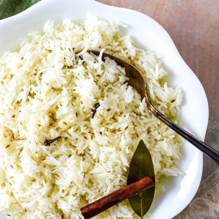 close up of rice with serving spoon in bowl
