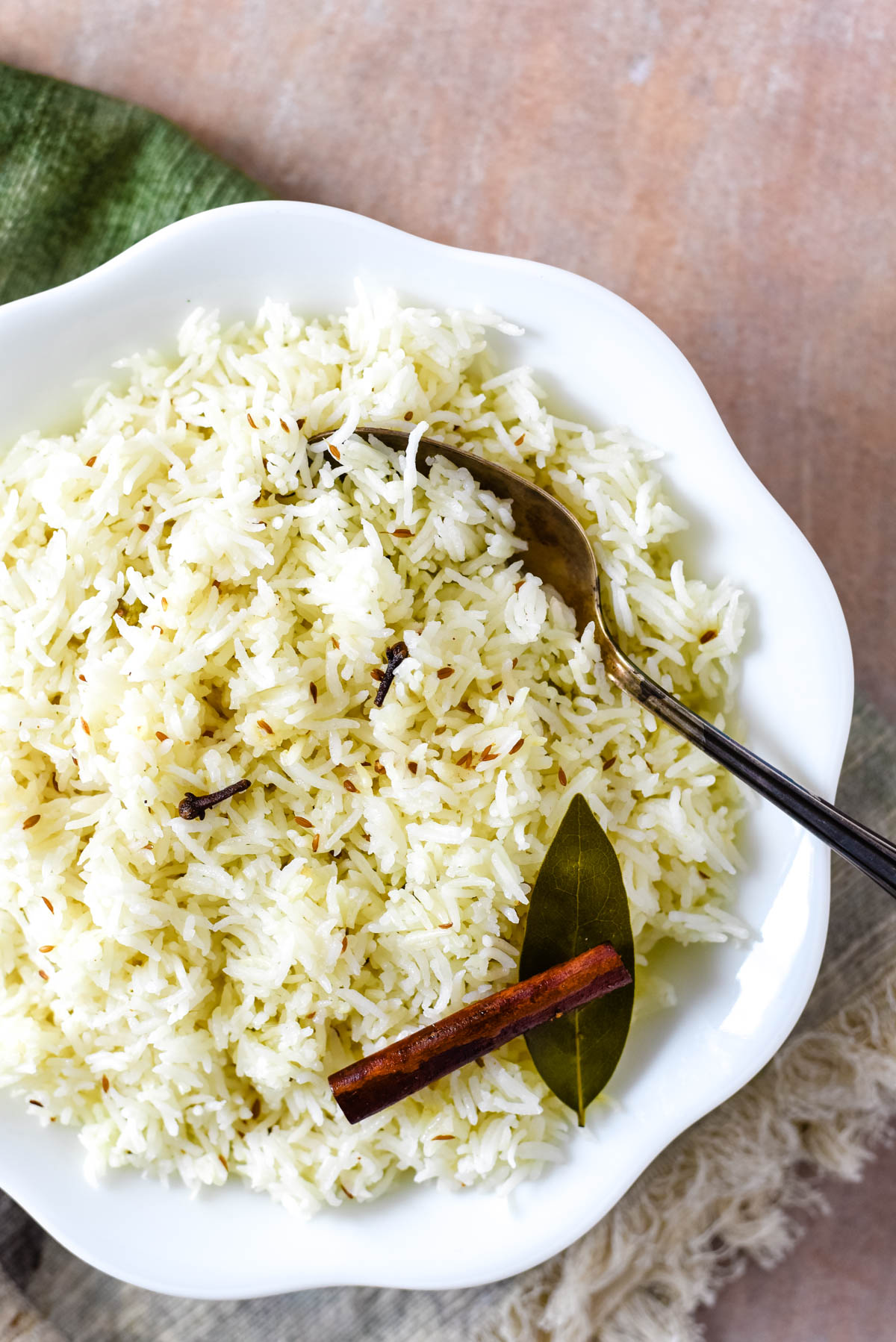 close up of rice with serving spoon in bowl