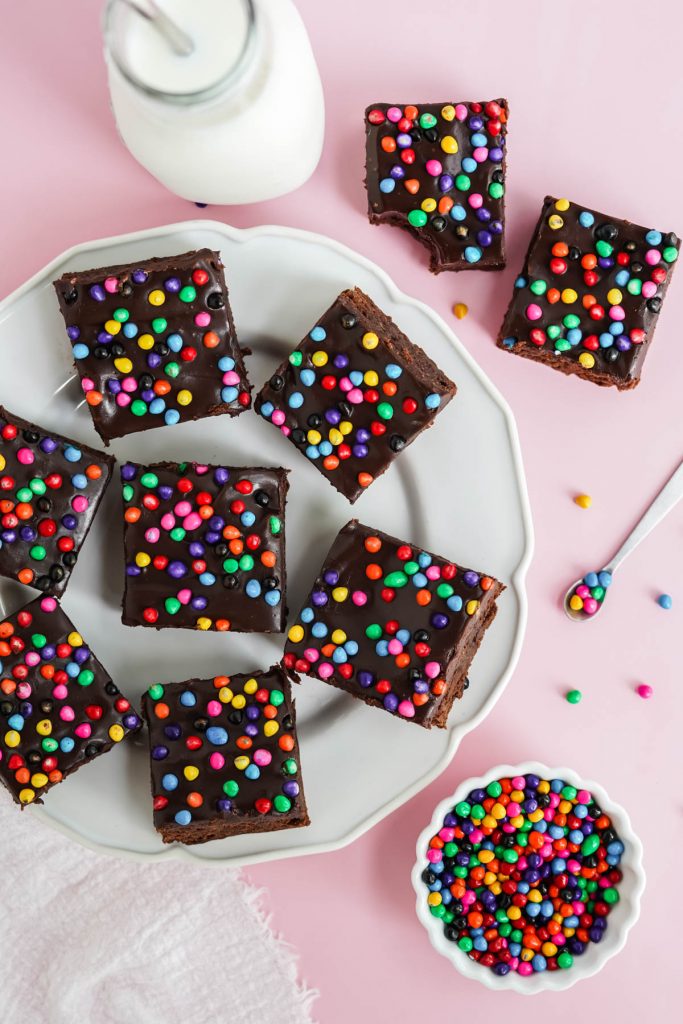 overhead image of brownies on plate with sprinkles around
