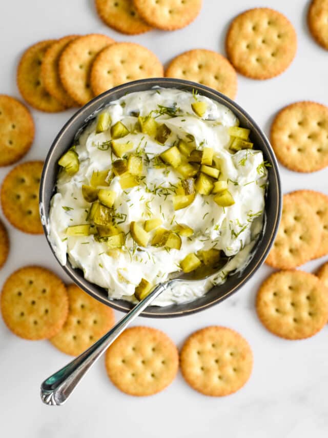 pickle dip in bowl surround by crackers