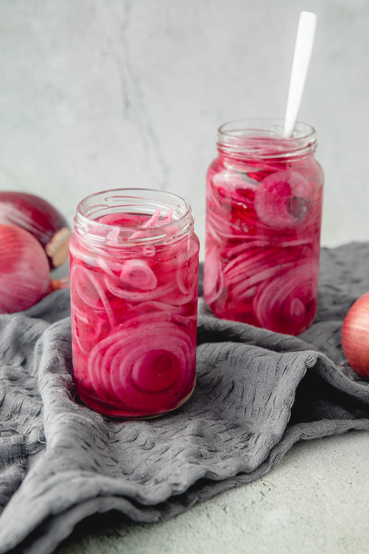 two jars of pickled red onions
