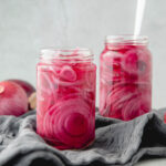 two jars filled with quick pickled red onions
