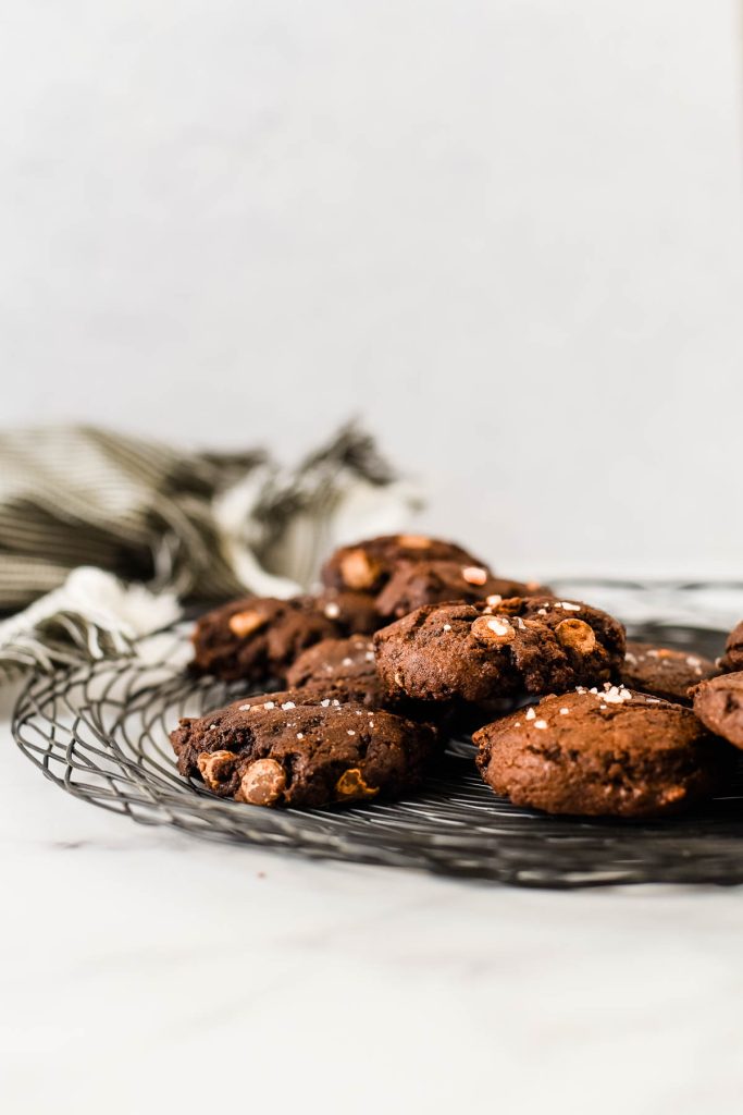 double chocolate rye cookies piled on wire rack
