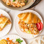 plates with servings of cajun chicken salad with croissants