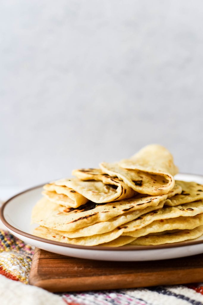 sourdough tortillas stacked on plate