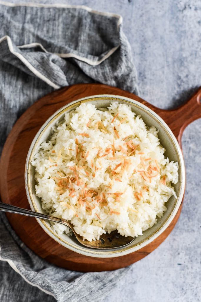 bowl with rice topped with toasted coconut