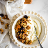 yogurt in bowl with granola on top