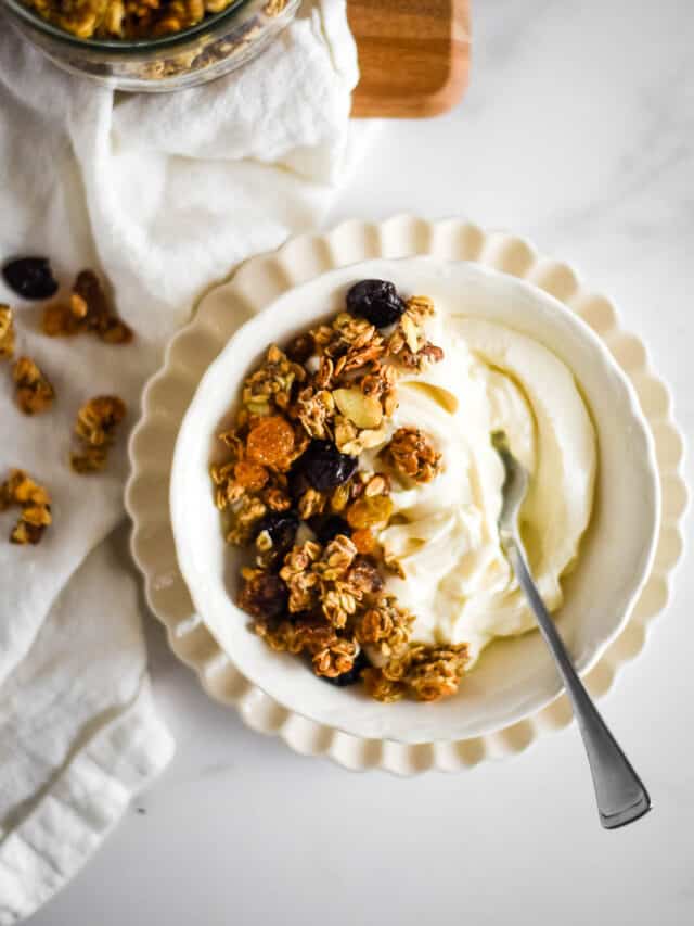 yogurt in bowl with granola on top