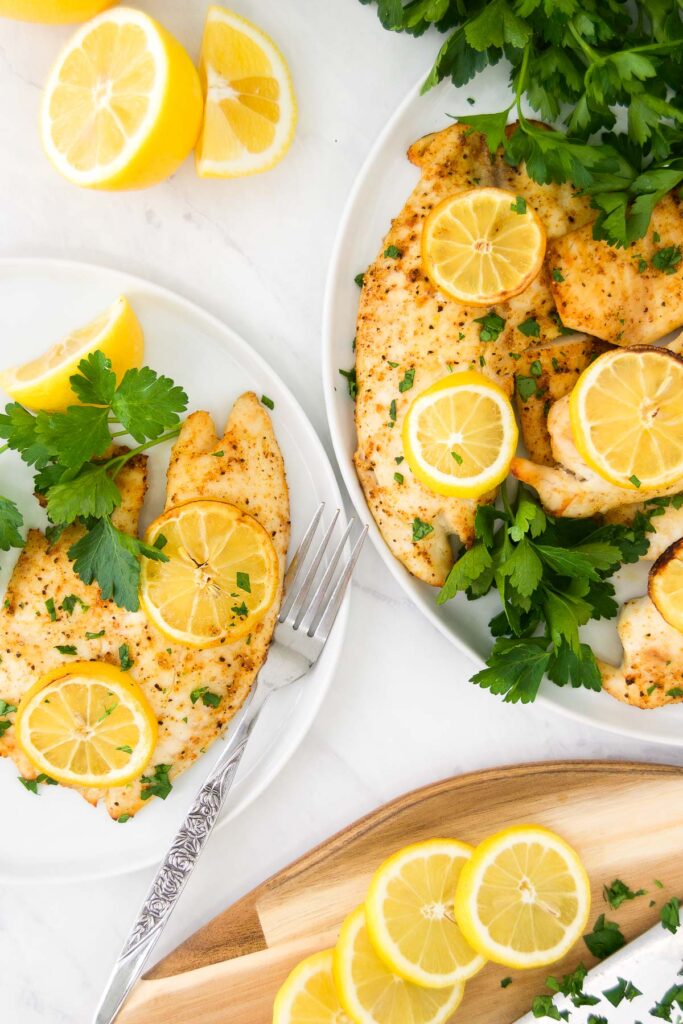 tilapia on serving platter with lemon
