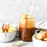 salted caramel sauce on top of two ice cream bowls