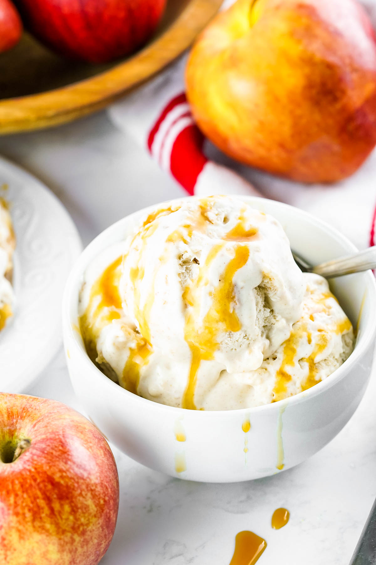 apple pie ice cream in bowl with caramel drizzles