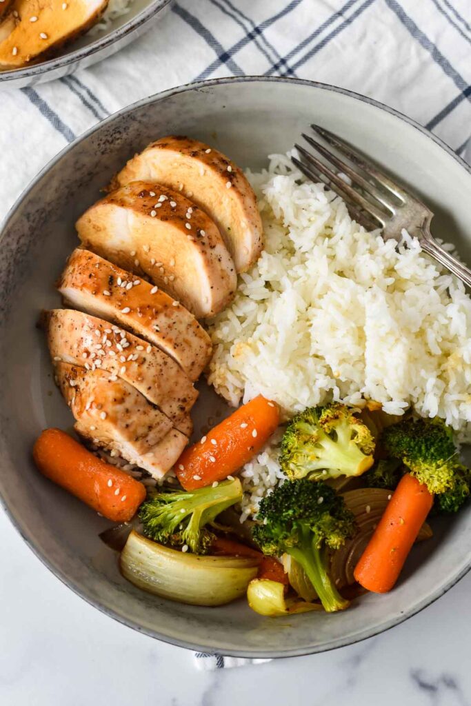 grey bowl with chicken teriyaki, rice and roasted vegetables