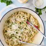 alfredo sauce made with milk and fettuccini pasta in white dutch oven