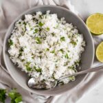 rice with cilantro and lime in serving bowl with spoon