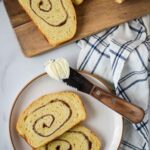 cinnamon swirl bread slice on plate with butter and knife