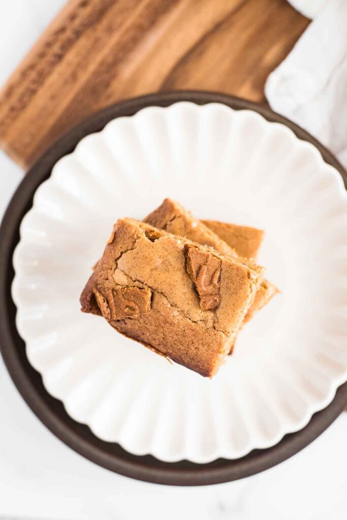 two blondies stacked on white plate