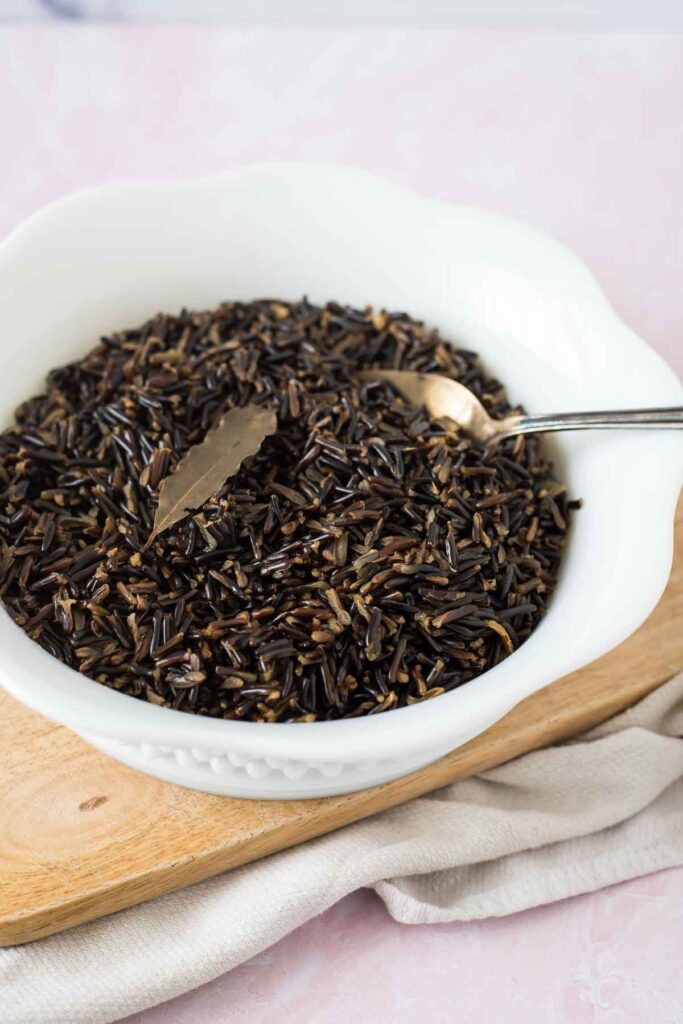 cooked wild rice in bowl with spoon