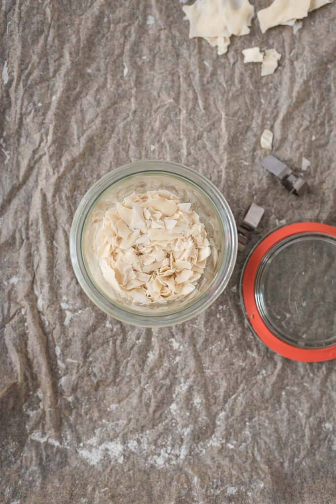 dried sourdough starter flakes in glass jar