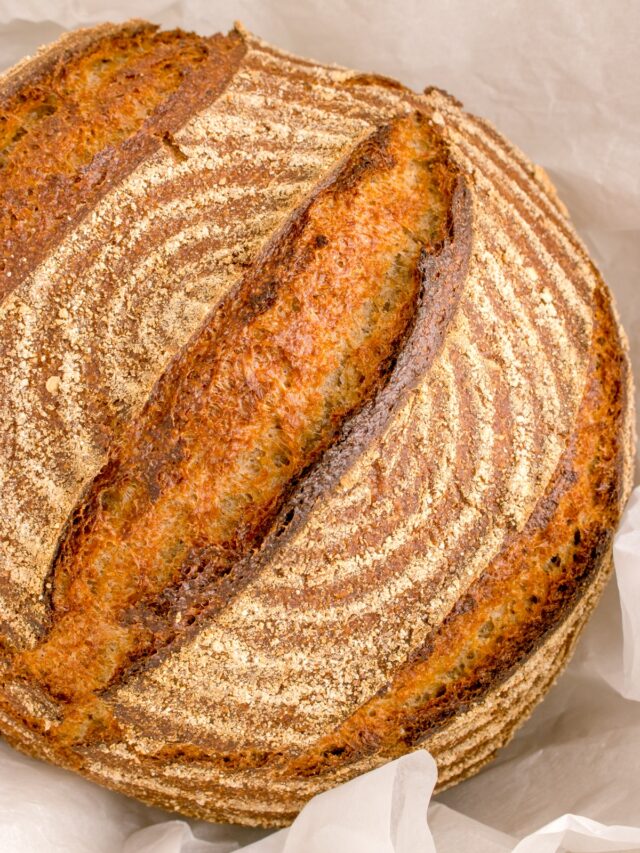 sourdough rye loaf surrounded by baking paper