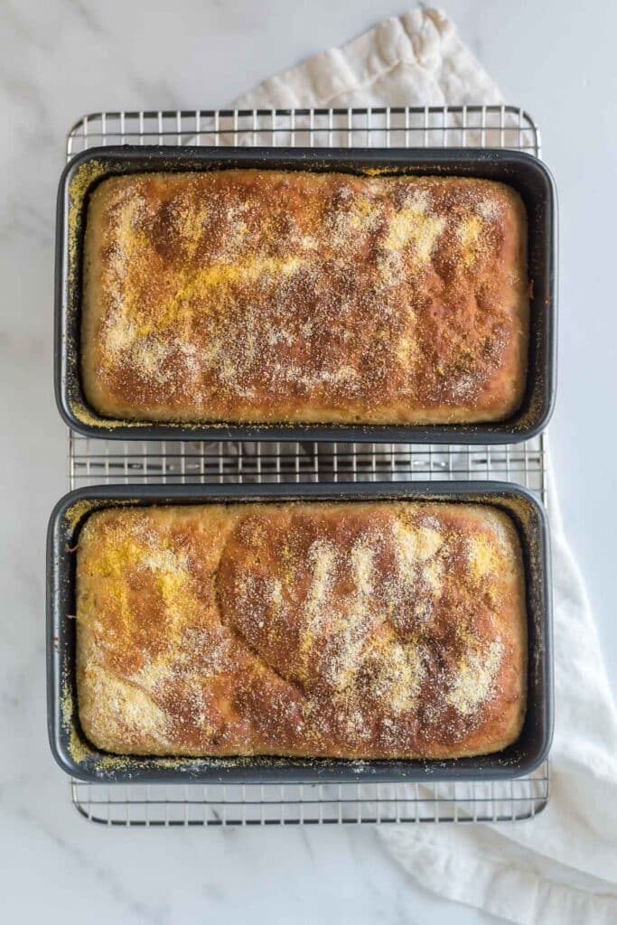 two bread pans with freshly baked bread