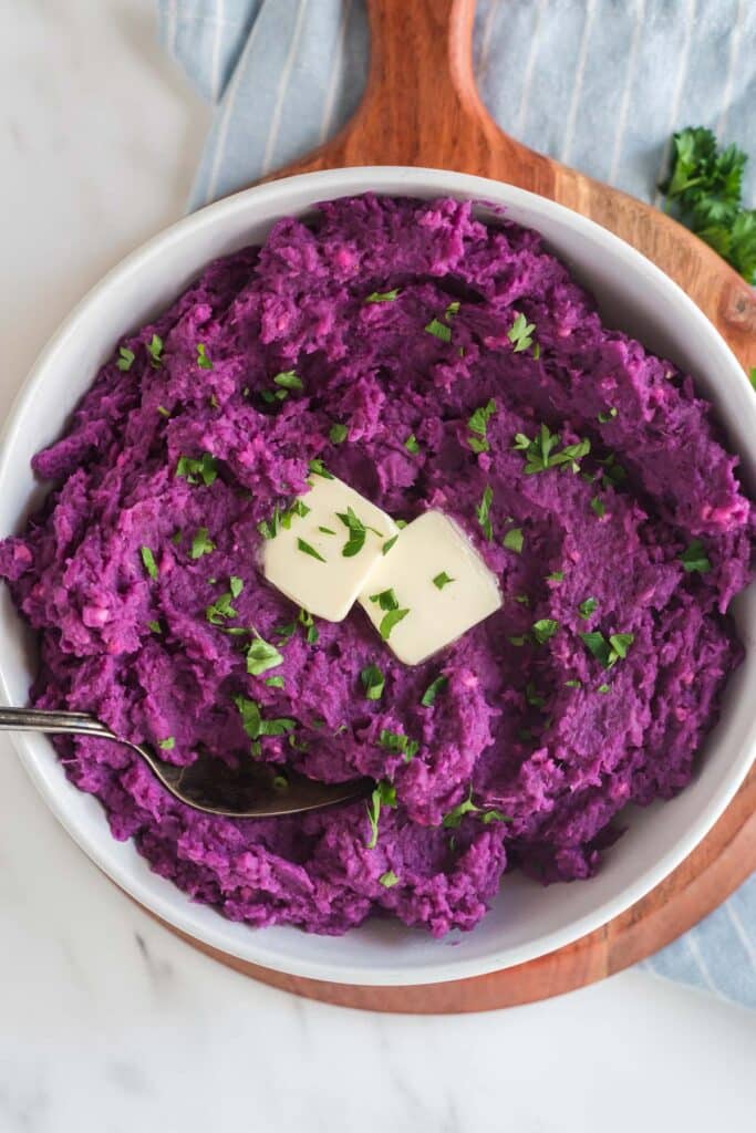 mashed purple sweet potatoes with pads of butter