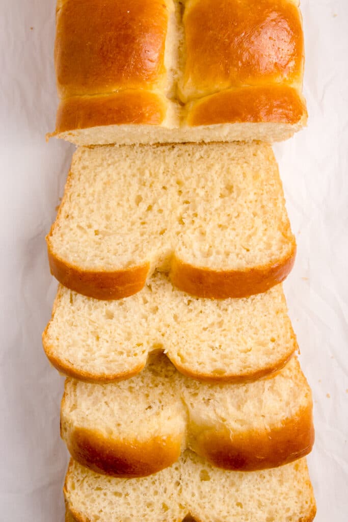 slices of sourdough brioche stacked in a splayed manner so you can see inside crumb