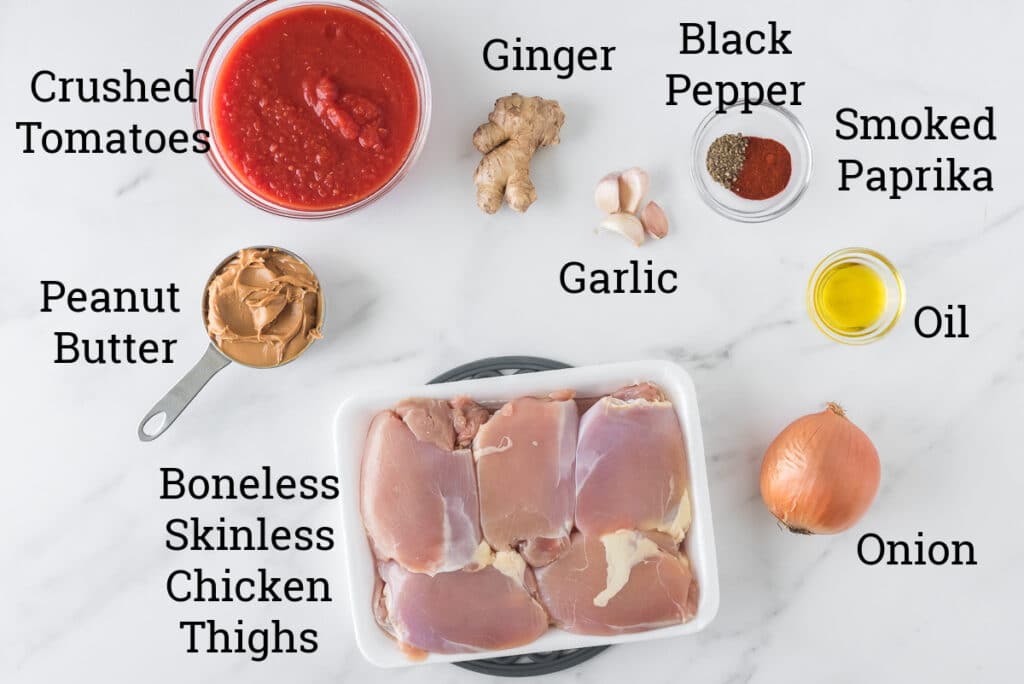 ingredients for peanut chicken stew on marble with text overlays