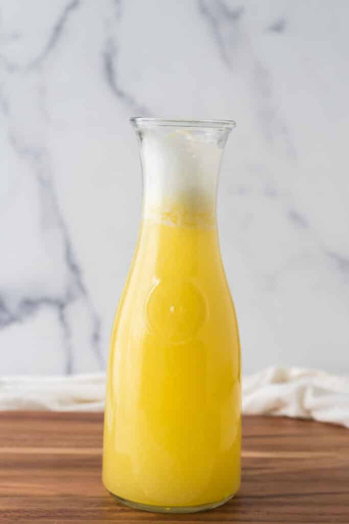 glass pitcher with pineapple ginger juice