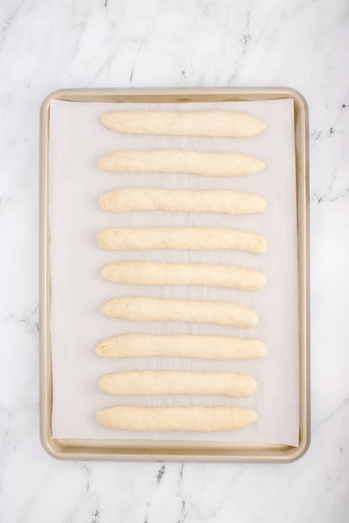 breadsticks ready for their rise on baking sheet