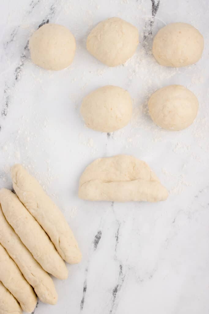 shaping dough balls into breadsticks